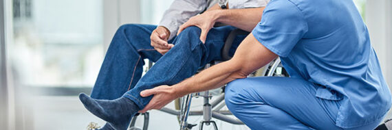 Therapist holding patient's leg