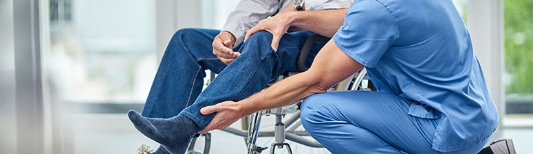 Therapist holding patient's leg