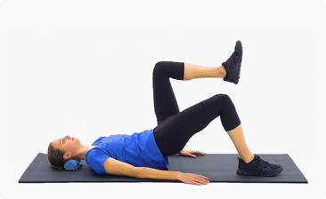 Person on a mat with head support doing a single-leg bridge, which can be guided by digital platforms like medbridge.