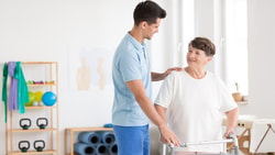 gentlement helping senior women - ampac score