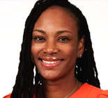 Woman with long dark dreadlocks in a bright orange top smiles, symbolizing digital healthcare and medbridge, against a white background.