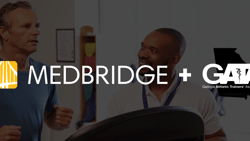 Two men talking with fitness equipment in front and medBridge and GATA logos visible.