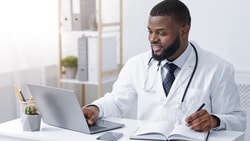 doctor on computer - minimal clinically important difference