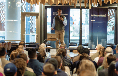 Medbridge presenter addressing an audience at an event.