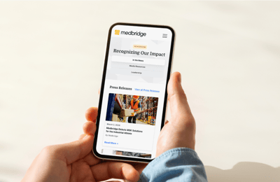 Phone screen showing Medbridge in the news.