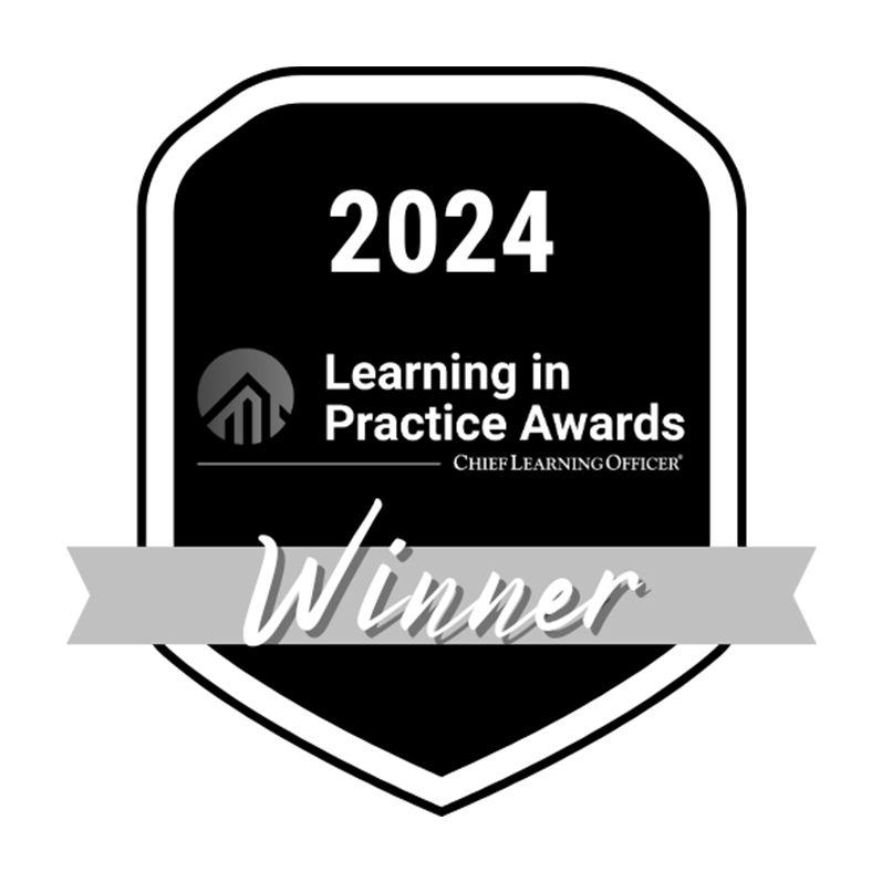 Black and white badge with "2024 Learning in Practice Awards, Chief Learning Officer," a silver "Winner" ribbon, honoring medbridge.