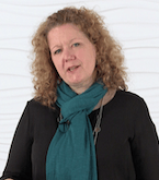 A woman with curly hair and a teal scarf, representing digital healthcare, stands against a white background.