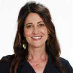 A smiling woman with long dark hair, wearing a dark blouse and gold earrings, represents healthcare education for medbridge.
