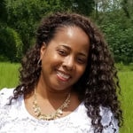 A smiling woman outdoors symbolizes the nurturing nature of digital healthcare and medbridge's patient care software.