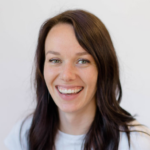 A smiling person with long brown hair against a white background represents Medbridge's digital healthcare innovation.
