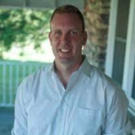 Man in white shirt on porch with blurred greenery, for a medbridge photo.