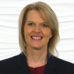 A smiling woman embodies the fusion of technology and personal care in digital healthcare, representing medbridge.