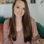 A smiling person with long brown hair in a mauve blouse sits on a couch, looking at the camera for Medbridge.