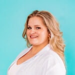 A smiling person with long blonde hair in a white shirt against a turquoise backdrop, symbolizing medbridge's digital healthcare harmony.