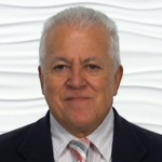 An older man in a dark suit represents hybrid care in digital health, tied to medbridge.