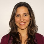 Smiling woman with long brown hair in a maroon top, on a white background for medbridge.
