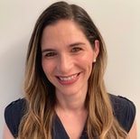 A smiling woman in a navy top represents digital healthcare for medbridge against a white background.