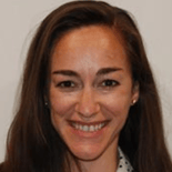 A cheerful individual with long brown hair represents Medbridge's digital healthcare future against a plain backdrop.
