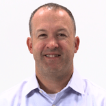 A smiling person in a light-colored shirt represents healthcare education's digital future, against a white background.