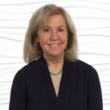 A smiling woman with blonde hair represents confidence from medbridge's digital healthcare education.