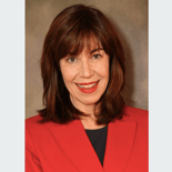A smiling person with shoulder-length brown hair in a red jacket represents medbridge's blend of personal care and technology.