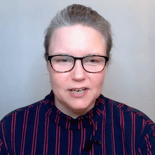 A person in glasses and a striped shirt talks about digital healthcare innovations for medbridge.
