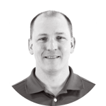 A person in a polo shirt with a small logo in black and white, representing medbridge's blend of traditional and modern digital healthcare.