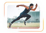 A male athlete sprints on a track with a stadium in the background, showing focus like medbridge training.