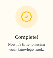 Yellow checkmark badge above the message: “Complete! Now it's time to assign your healthcare education track.”.