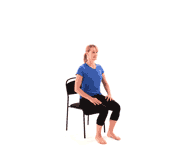 A woman in a blue shirt and black pants performs seated leg raises, highlighting digital healthcare's role in fitness with medbridge.