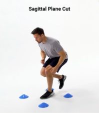 A person navigates sideways between blue cones in a gray shirt and black shorts for Medbridge agility training.