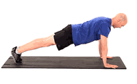 A person in a blue shirt and black shorts performs a push-up on a mat for Medbridge healthcare training.