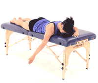 A person relaxes on a massage table during Medbridge hybrid care.