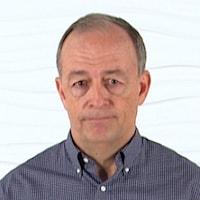 A person in a checkered shirt stands against a white background, embodying the dynamic field of healthcare education for medbridge.