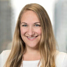 A smiling person with long blonde hair wearing a white top represents healthcare education for medbridge.
