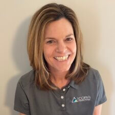 A person in a "CORA Physical Therapy" polo shirt symbolizes digital healthcare integration with medbridge.