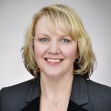 A person with short blonde hair smiles confidently, exemplifying the impact of medbridge's patient care software.