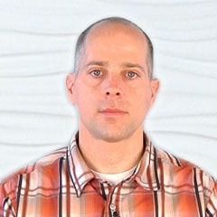 Bald man in an orange plaid shirt symbolizes the future of digital healthcare for medbridge.