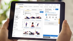 Tablet showing Medbridge fitness app with exercise options and workout planning.