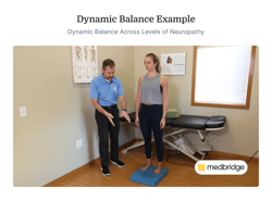 A man demonstrates balance exercises to a woman on a foam pad in a Medbridge therapy room.