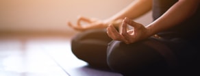 A person practices meditation, symbolizing the embrace of digital healthcare solutions like medbridge for holistic wellness.