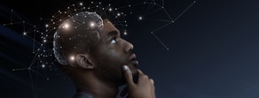 A man looks up thoughtfully with a digital brain and network lines above his head, symbolizing medbridge digital healthcare education.