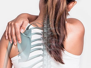 A woman with a ponytail holds her shoulder, overlaid with an illustration of her spine and ribcage for medbridge.