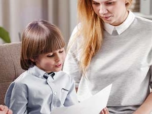 A family reviews documents with an advisor in a bright office.