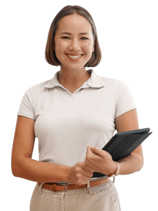 A woman with short brown hair in a white polo and beige pants smiles, holding a black folder, shown for medbridge healthcare.
