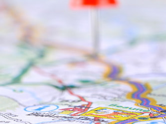 Map with red and blue push pins indicating specific locations.