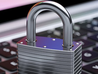 A silver padlock on a laptop keyboard symbolizes internet security or data protection, reflecting medbridge's commitment.