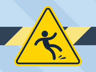 Caution sign showing a person slipping against a black and yellow striped background.
