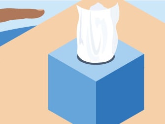A hand reaches for a blue tissue box on a wooden table, next to a medbridge sign.