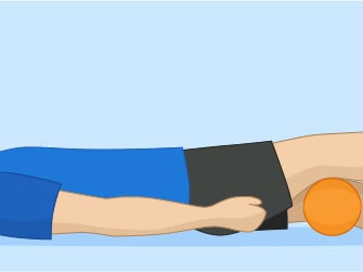 Individual on their back with a cushion under their knees, lifting one leg.